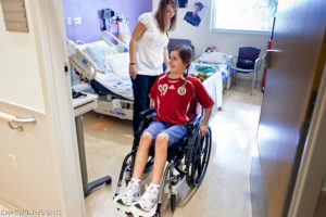 girl in wheelchair in hospital