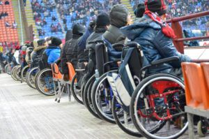 row of people in wheelchairs at an event